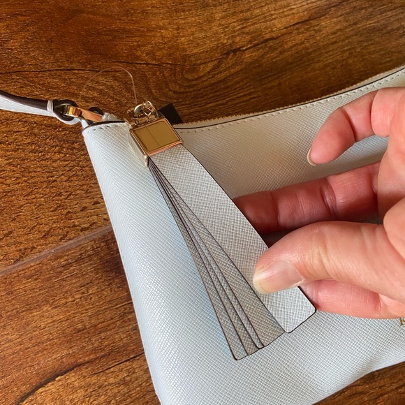 NWT Kate Spade Sadie Crossbody it’s in a “Crisp Sky” blue. It’s very light blue - Picture 7 of 11